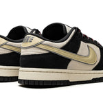 Tênis Nike Dunk Low "Black Team Gold" Preto / Dourado